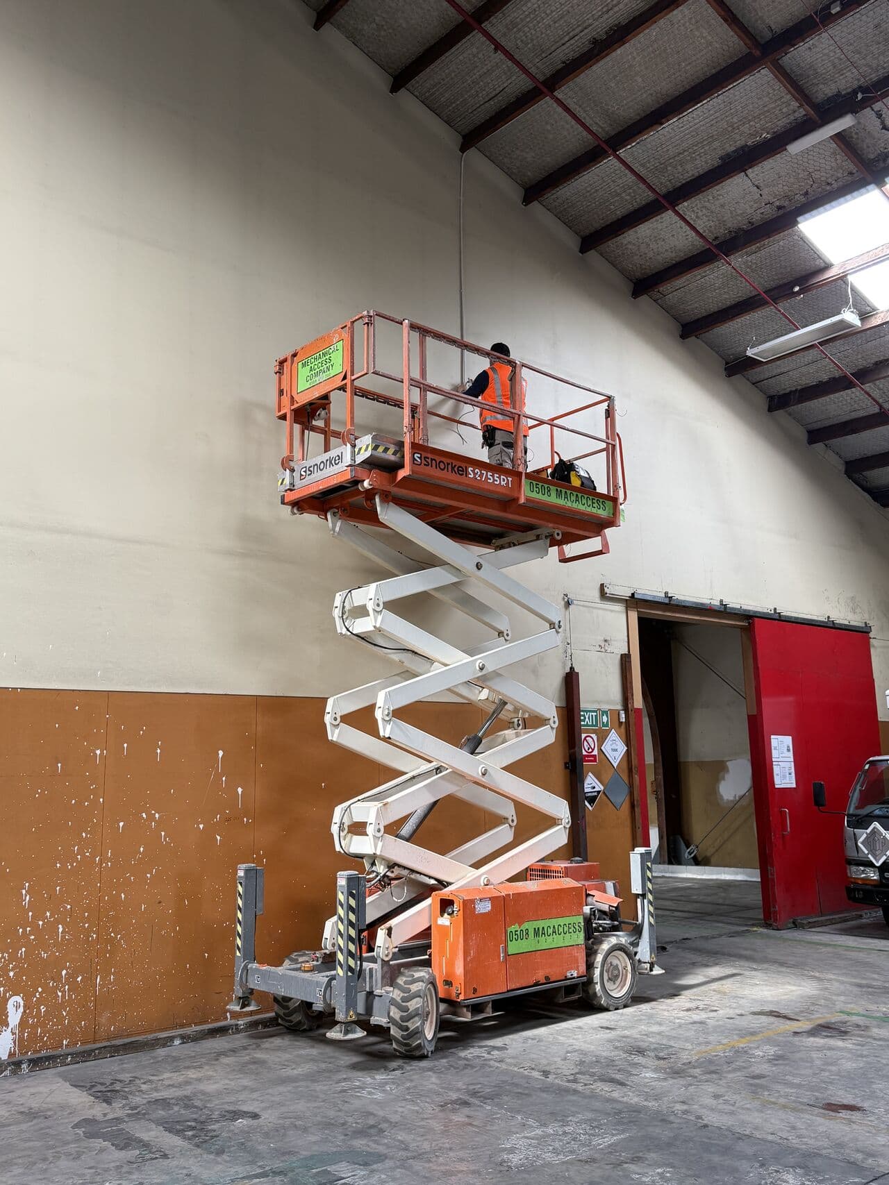 DC Security technician completing an elevated installation